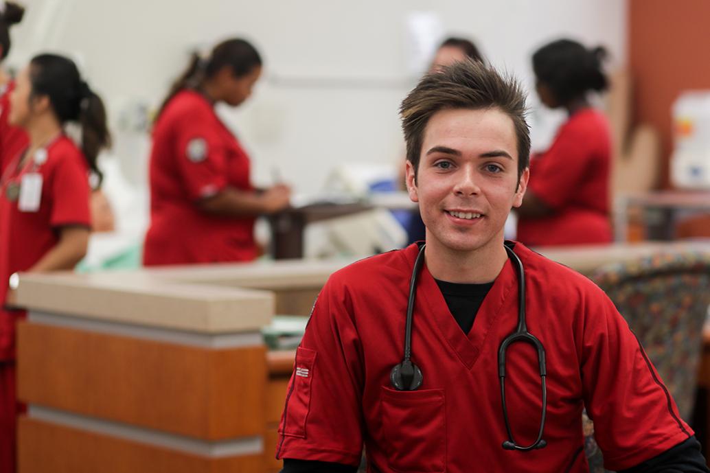 Oliver Smith poses in McCord nursing lab