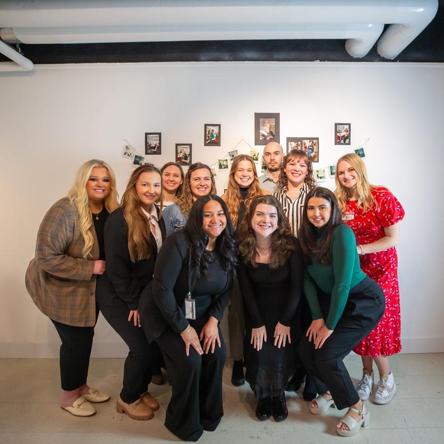 SLP Students posing in the gallery for a group photo